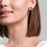 Round emerald and diamond bezel set earrings on model