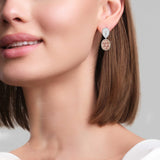 Oval Morganite and pear Diamond dangle Earrings - 18K Rose Gold on model