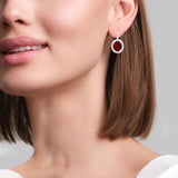 Oval Ruby and Diamond drop dangle Earrings, 18K White Gold on model