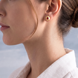 Raw Ruby Stud Earrings, 18K Textured Gold on model