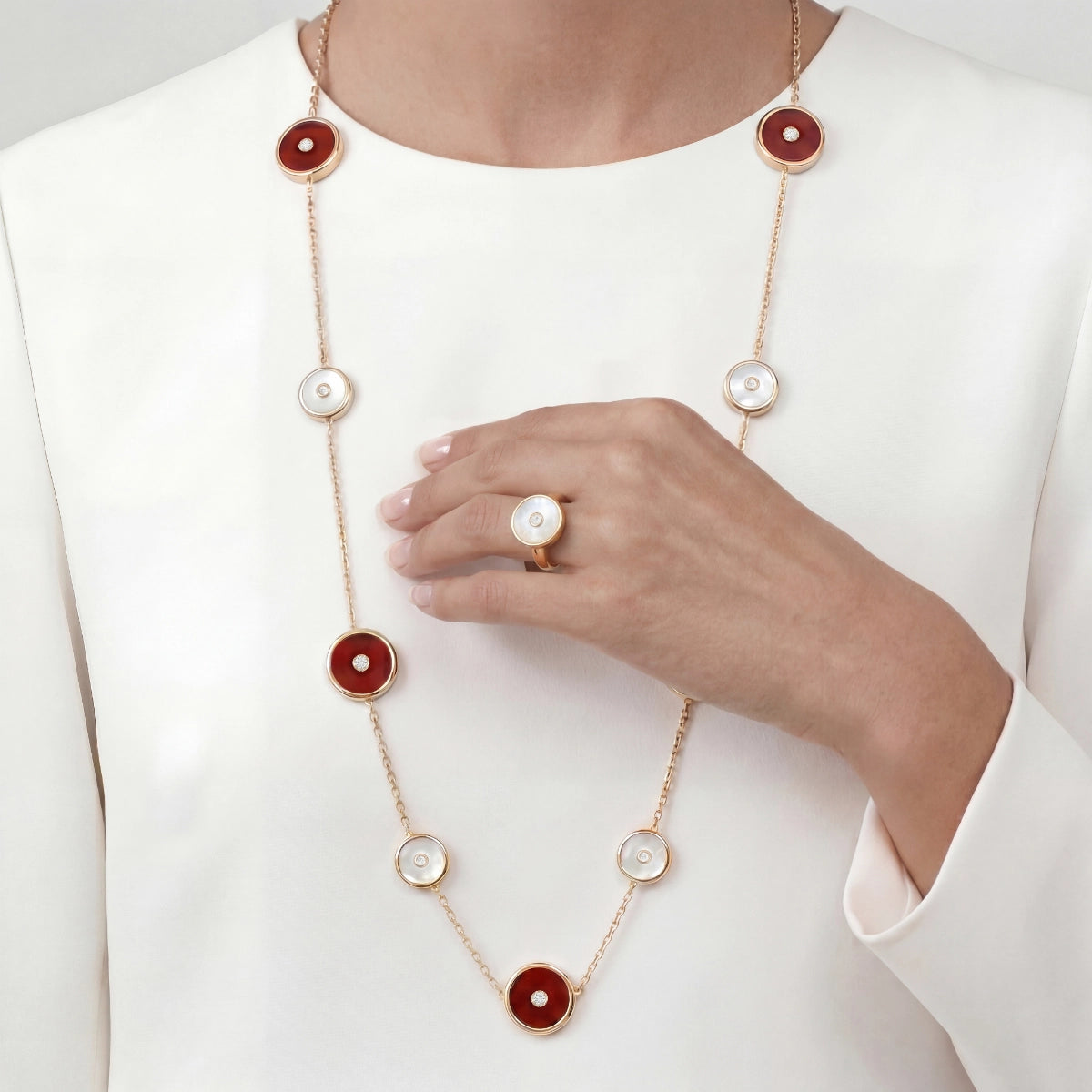 carnelian and mother of pearl motifs necklace and ring set on model