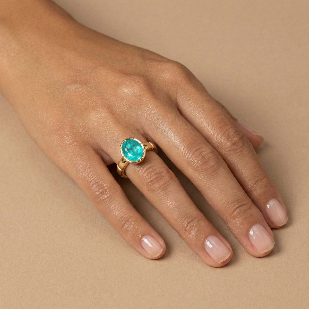 Oval Paraiba Tourmaline Bezel Set Ring on model